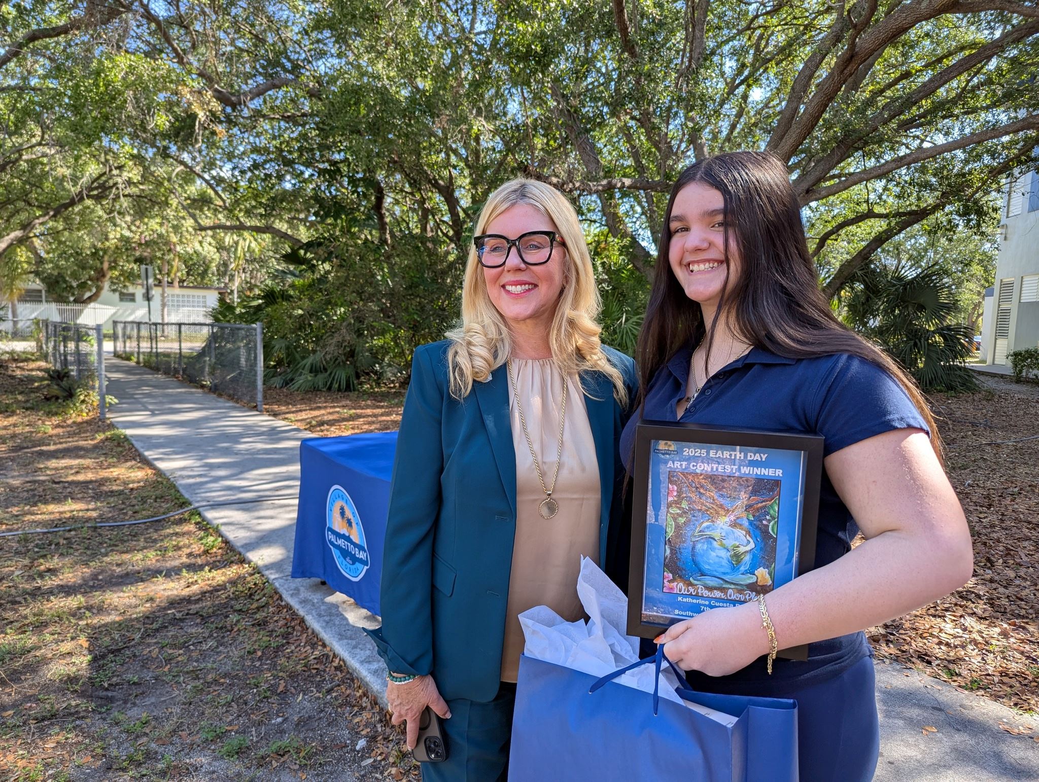mayor cunningham and art winner katherine cuesta posing for the camera
